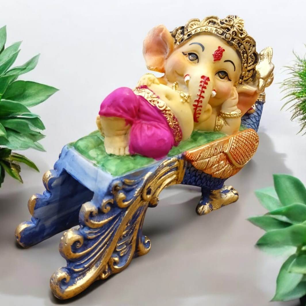 Multicolor Ganesha Lying on Peacock Resin Statue | EnamorarDecor