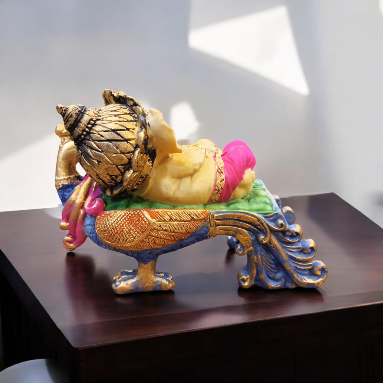 Multicolor Ganesha Lying on Peacock Resin Statue | EnamorarDecor