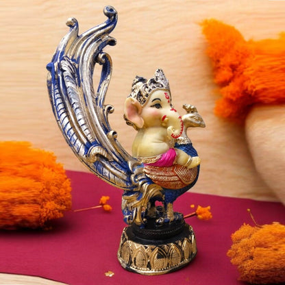 Multicolor Ganesh Sitting on Peacock Resin Statue | EnamorarDecor