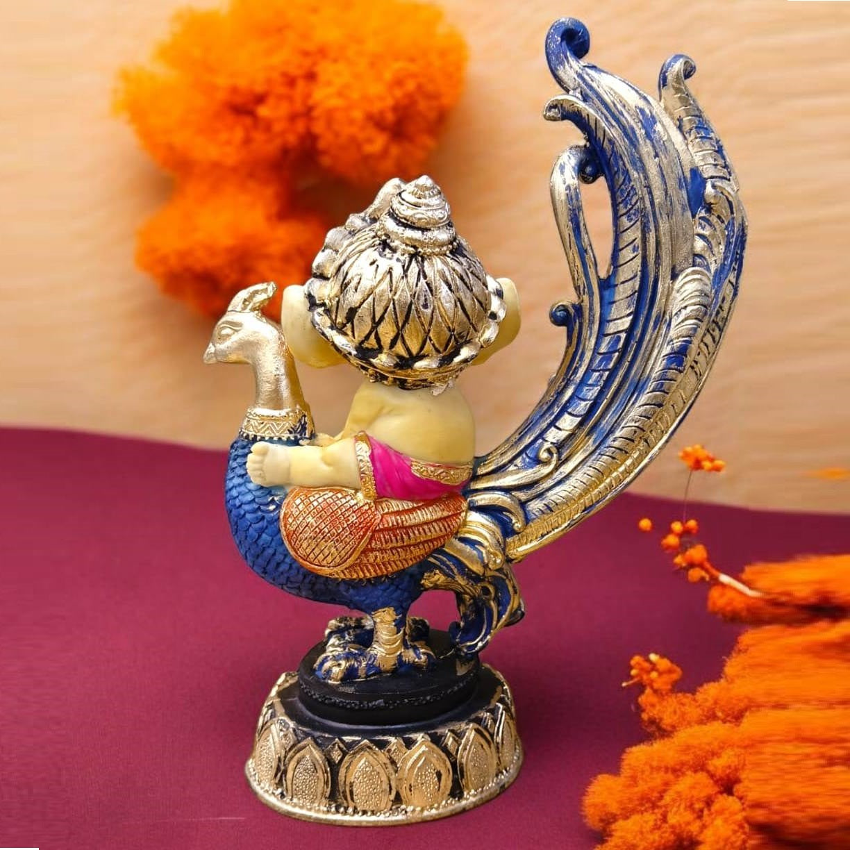 Multicolor Ganesh Sitting on Peacock Resin Statue | EnamorarDecor